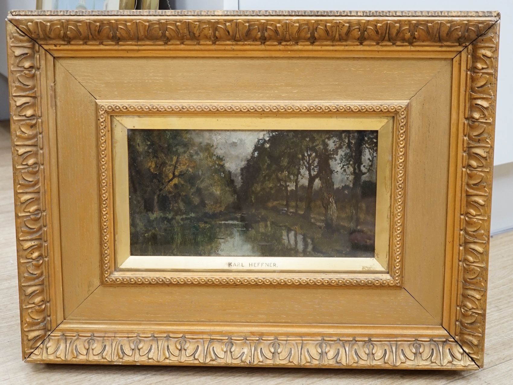 Karl Heffner (1849-1925), oil on artist's board, Study from nature, Bavaria, unsigned, inscribed to the mount, stencil verso 977J, 14 x 26cm, ornately framed. Condition - fair to good, a little dirty